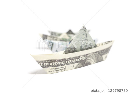 Money Origami boat with one hundred Dollar bills Money Origami boat with one hundred Dollar bills 129798780