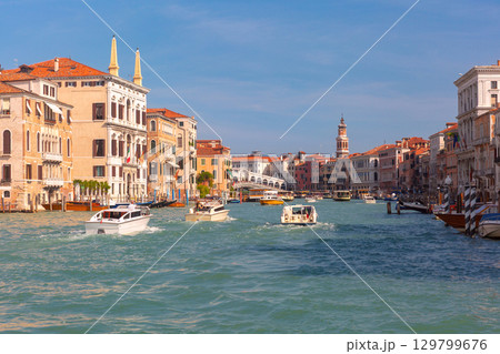 Historic canal house with boat in Venice Italy 129799676