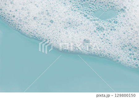 Texture of white foam. Cleansing mousse for the face or bath foam or washing powder. Copy space 129800150