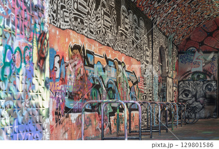 a row of metal structures in Leake Street Arches (Banksy Tunnel) that serve as bicycle wheel locks. 129801586