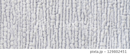Texture of light gray background from soft fluffy textile material macro. Structure of white plush fabric backdrop 129802451