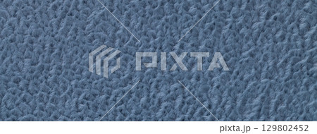 Texture of dark blue background from soft fluffy textile material macro. Structure of denim plush fabric backdrop Texture of dark blue background from soft fluffy textile material macro. Structure of denim plush fabric backdrop 129802452