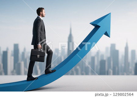 Businessman walking on giant blue arrow path with briefcase against city skyline, symbolizing career growth and success motivation 129802564