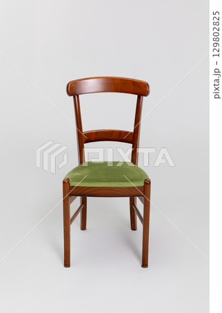 Beautiful Vintage Wooden Chair featuring Green Fabric Upholstery, perfect for any room 129802825