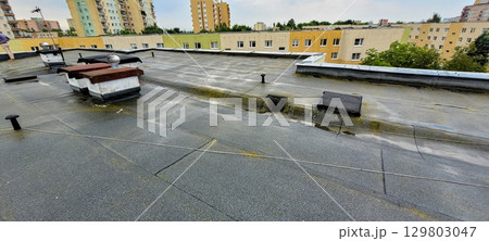 Rooftop View with Rain Urban Landscape, showcasing the intersection of nature and architecture 129803047