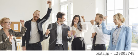 Team Of Happy Business People Celebrating Success Together In Office Team Of Happy Business People Celebrating Success Together In Office 129803749