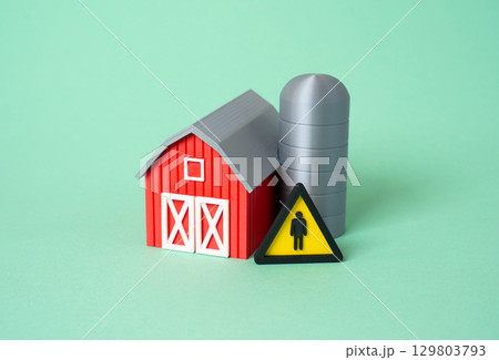 Farm barn and shortage of agricultural workers. Shortage of workers for harvesting. 129803793