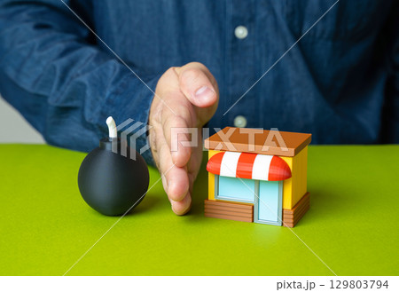 Man protects shop from bomb, concept. Business protection, damage insurance. Man protects shop from bomb, concept. Business protection, damage insurance. 129803794