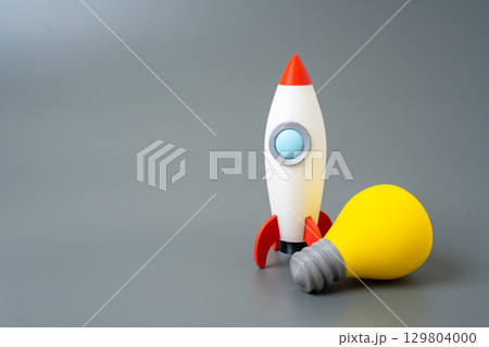 Rocket and light bulb. Startup ideas and technologies. Launch of innovative technologies. 129804000