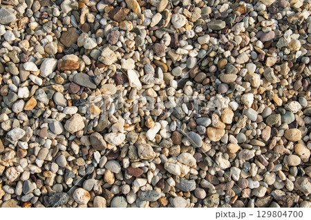 Natural river pebbles background with multicolored stones Natural river pebbles background with multicolored stones 129804700