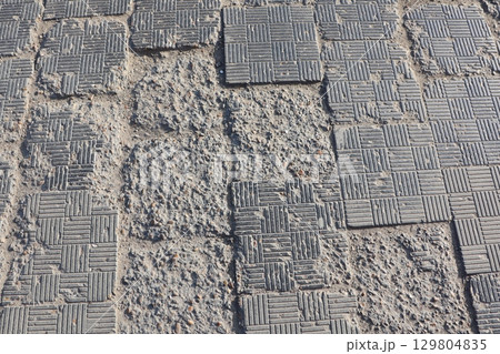 Detailed overview of Textured Pavement that exhibits various Wear and Tear Patterns Detailed overview of Textured Pavement that exhibits various Wear and Tear Patterns 129804835