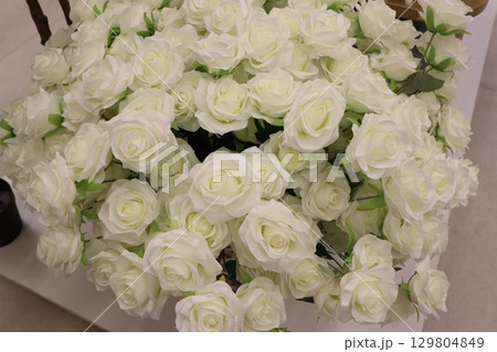 An elegant bouquet of pristine white roses, ideal for any memorable special occasion An elegant bouquet of pristine white roses, ideal for any memorable special occasion 129804849