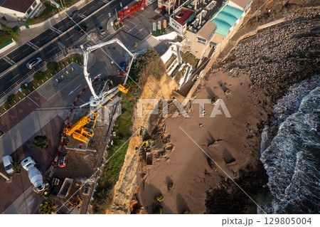 Drone view of shoreline stabilization work with 129805004