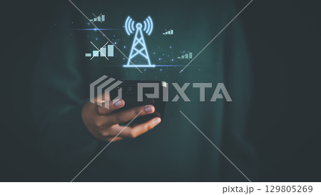 The mobile network is not working. Hand holding a smartphone with glowing signal tower and disconnected icons, illustrating network issues, weak signal, or no connection concept. The mobile network is not working. Hand holding a smartphone with glowing signal tower and disconnected icons, illustrating network issues, weak signal, or no connection concept. 129805269