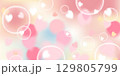 A golden yellow and peach gradient vector background with soft heart bubbles floating in a magical bokeh effect. This warm, luminous illustration brings an elegant and cheerful touch, ideal for 129805799