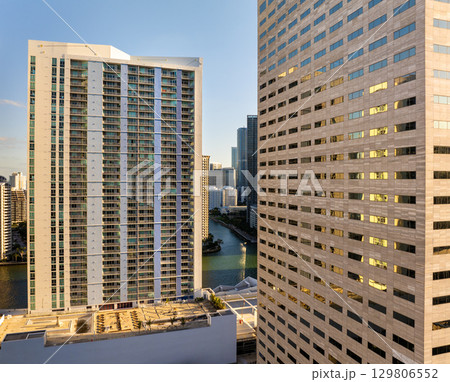 Miami, Florida, USA. Aerial view of American downtown office district at sunset. High commercial and residential skyscraper buildings in modern US city 129806552