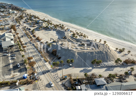 Hurricane Milton aftermath cleanup. Piles of sand at Charlotte County sand recipient site at Englewood Beach on Manasota Key 129806617