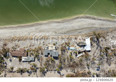 Natural disaster and its consequences. Hurricane destroyed houses roof and walls in Florida coastal area 129806620