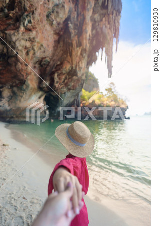 couple tourist travel and sightseeing in Krabi, Thailand. happy traveller enjoy on beach at Phra nang Cave Beach near Railay Beach. Honeymoon, tropical destination, Travel and summer vacation concept 129810930