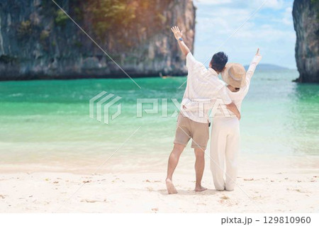 Couple tourist traveling and sightseeing in Krabi, Thailand. happy traveller enjoy on beach at koh Hong island. Honeymoon trip, destination, Southeast Asia Travel, summer vacation and holiday concept 129810960