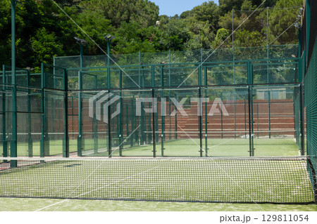 Close-up of net on tennis court, stadion, arena. Sport lifestyle background. Concept of professional game sports Close-up of net on tennis court, stadion, arena. Sport lifestyle background. Concept of professional game sports 129811054