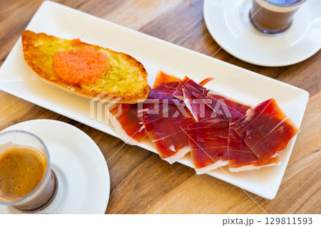 Ham sandwich and coffee served for breakfast Ham sandwich and coffee served for breakfast 129811593