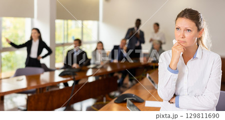 Upset middle aged white blond female employee getting fired Upset middle aged white blond female employee getting fired 129811690