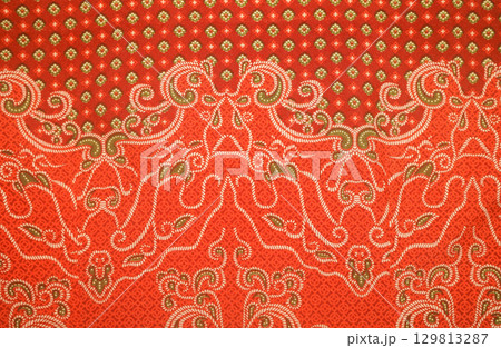 Elegant textile details of orange batik pattern Indonesia Elegant textile details of orange batik pattern Indonesia 129813287