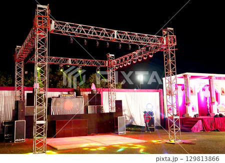 Outdoor Wedding DJ Stage with Truss Lighting Setup 129813866