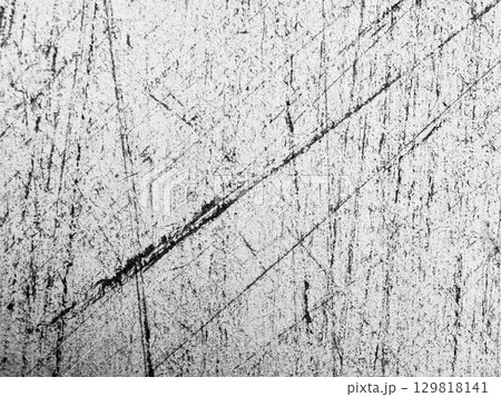 Unique texture of scratched metal surface captured in black and white showcasing intricate patterns and lines 129818141