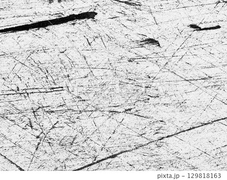 Surface of scratched wood reveals intricate patterns and textures created over time in a natural setting Surface of scratched wood reveals intricate patterns and textures created over time in a natural setting 129818163