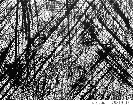 Abstract black and white texture with sharp diagonal lines created through dynamic brush strokes on a canvas surface 129819138