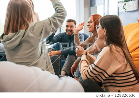 Talking, helping each other. Group of people are having therapy meeting together 129820636