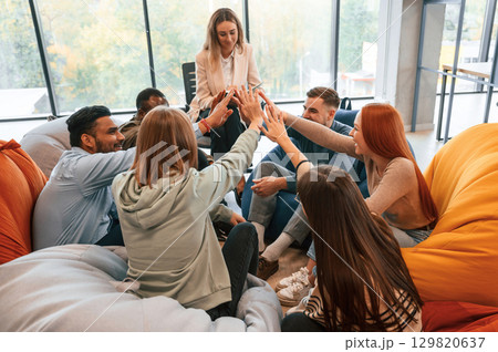 Talking, helping each other. Group of people are having therapy meeting together Talking, helping each other. Group of people are having therapy meeting together 129820637