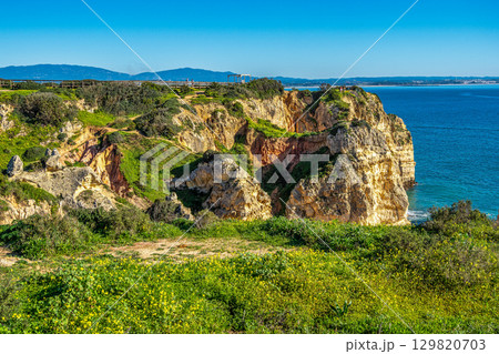 Ponta da Piedade is a unique rock formation with famous grottos in the ocean at Lagos, Algrave, Portugal Ponta da Piedade is a unique rock formation with famous grottos in the ocean at Lagos, Algrave, Portugal 129820703