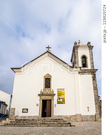 The facade of the Mother church of Sao Salvador in Sines, Portugal 129820724