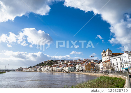 Alcacer do Sal, Portugal view from across the Sado River with Santiago Church on the right and Castle on the left 129820730