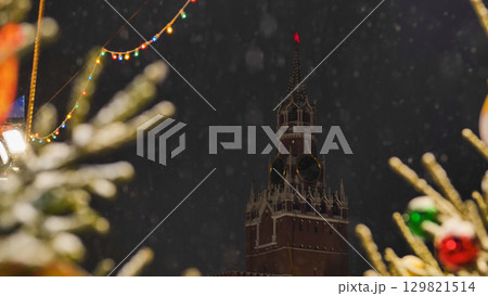 Spasskaya Tower of Moscow Kremlin on snowy New Year's Eve Spasskaya Tower of Moscow Kremlin on snowy New Year's Eve 129821514