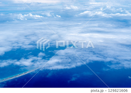 Aerial view of the Tuamotus atoll in French Polynesia with clouds 129821606