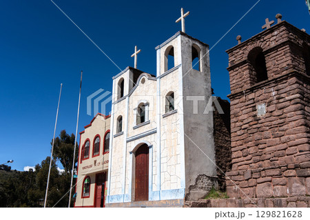 Church and municipal building of Llachon near Lake Titicaca, Peru 129821628