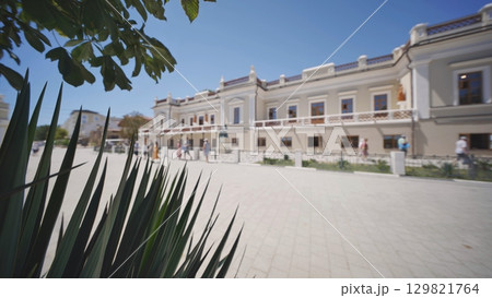 A street plant against the background of buildings in Feodosia, Crimea. A street plant against the background of buildings in Feodosia, Crimea. 129821764