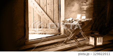 Manger in the barn. Christmas background 129822011