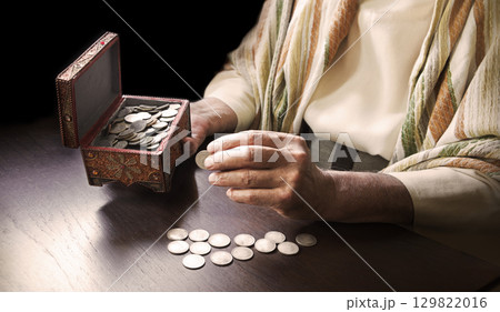 Man with a cash in the box Man with a cash in the box 129822016