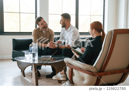 Conception of love. Gay couple at a psychologist's appointment 129822780
