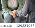 Psychologist or family holding hands to encourage patient with depression, mental health concept 129823027