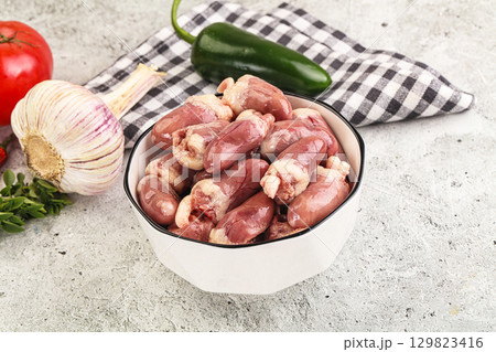 Fresh raw chicken hearts in the bowl 129823416