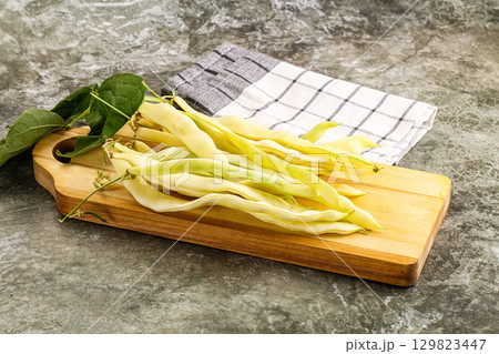 Raw green bean strings heap 129823447
