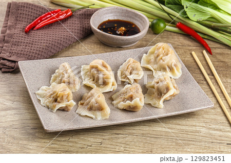 Asian steamed dumplings with meat 129823451