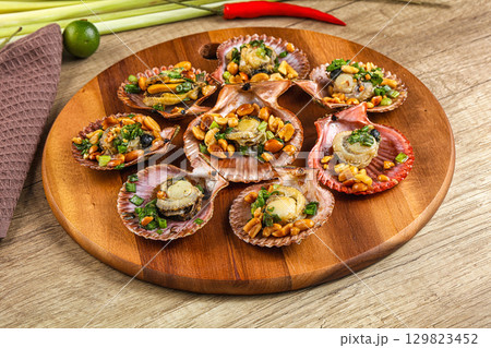 Baked scallops with scalion oil Baked scallops with scalion oil 129823452