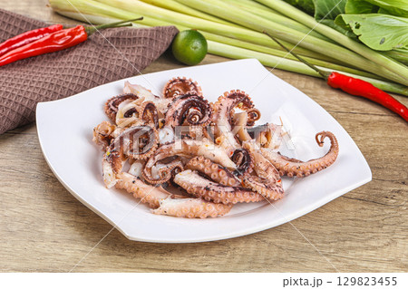 Grilled octopus tentacle sliced appetizer 129823455